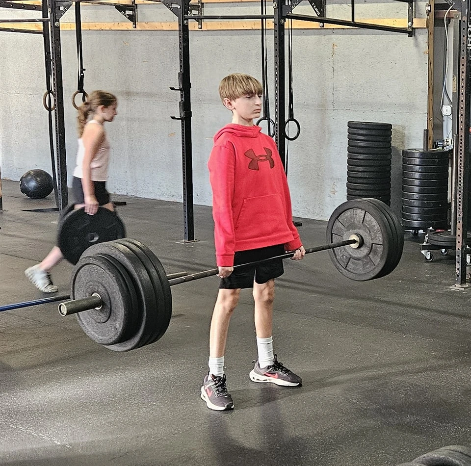 Teen lifting weights